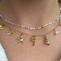 Boho gelaagde ketting met kleurrijke kralen en gouden oceaanhangers zoals zeesterren en schelpen - Oceaan Kralen Dubbellaags Stijl (J) / Gekleurde Kralen Goud