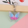 Porte-clés papillon en acrylique dégradé bleu et rose avec fermoir mousqueton argenté - Papillon bleu rêveur