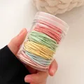 Hochelastisches Haargummi-Set in Macaron-Farben im transparenten Aufbewahrungsbehälter - Dose Eiscreme Serie (100 Stück/Packung)