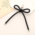Chic black faux leather bow bag charm with a secure metal spring clasp accessory - Leather Bow Charm / Black
