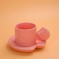 Chubby ceramic coffee mug and seashell-shaped saucer set in pastel pink finish - Shell Shape Cup + Saucer - Pink