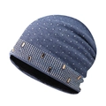 Detail of dark blue knit beanie featuring sparkling rhinestones and gold metal studs - Blue