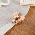 Mini acetate hair claw clip featuring a brown and beige marbled pattern for styling - Caramel Milk Cap