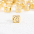 Macro shot of 18k gold plated cube bead with zircon letter G for jewelry making - G (Single Pendant)