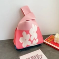 Pink knitted tote bag with white flower patterns and a unique single handle design - Pink Floral
