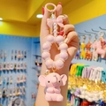 Pink cartoon elephant keychain with golden crown, pink beads and bow, held in hand - Bead Chain Set / Pink