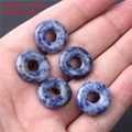Detailed view of 18mm natural blue spot stone beads held in hand for jewelry making - 18mm Peace Buckle (5pcs)