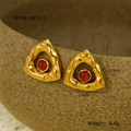 Macro view of triangle crinkled gold earrings with red natural stone on ceramic pot - Gold with Red Stone (NMSE-A812-2)