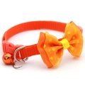 Orange polka dot bow pet collar with bell for cats and small dogs on white background - Orange