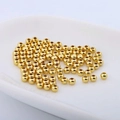 18k gold plated copper spacer beads for jewelry making displayed in a white ceramic dish - 18K Gold Plated