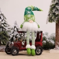Christmas gnome plush toy in a red vintage truck on snow background - Green Long Legged Doll With Light (E-DD06)