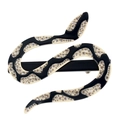 Close-up of black and cream acetate snake hair clip with shimmering rhinestones - Black Duckbill Clip