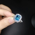 Adjustable open ring featuring a rectangular blue gemstone and small side diamonds - Adjustable Open / Blue Stone White Gold
