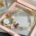 Detail of golden charm bracelet watch with pink floral pendant and crystal beads in a box - Gold Heart Cherry Blossom Bangle