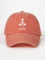 Detail of the vintage washed cotton texture and deadlift skull print on the red baseball cap - Adjustable / Orange