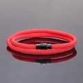 Red double-wrap braided couple bracelet with black magnetic metal clasp on grey background - Red