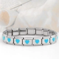 Macro shot of turquoise heart charm on square link elastic stainless steel bracelet - 0187-heart-blue 1st Festival