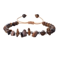 Handmade woven bracelet featuring tiger eye stone beads and polished silver copper accents - Tiger's Eye