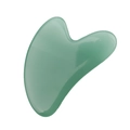 Macro shot of a heart-shaped green jade resin gua sha board with smooth polished edges - Resin / Green