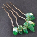 Macro detail of handmade gold wire-wrapped green crystal hair comb for weddings - Dark Green Crystal + Gold Comb