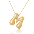 Macro shot of gold bubble letter M pendant on a thin rectangle chain necklace - M (D1013)