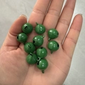 Set of ten 14mm green candy-colored painted metal bells held in hand for pet collars - Dark Green