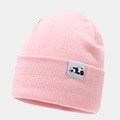 Close-up of pink knit beanie featuring a cute panda patch and soft ribbed texture - Pink