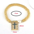 Detailed macro view of golden beaded bracelet with zircon cross pendant and pearl - Turquoise Cross Pendant
