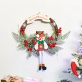 Close-up of a Christmas wreath with a snowman, red berries, and a Merry Christmas banner - Large Branch Snowman Style