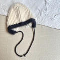 Detail of plush knit winter hat with contrasting trim and long earflap ties - 3-6 Years / Beige
