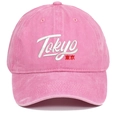 Pink washed cotton baseball cap with Tokyo embroidery in a minimalist studio view - Pink