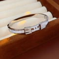 Macro shot of silver titanium bracelet with white mother-of-pearl and zircon details - T-Shape Mother Of Pearl Zircon Style (Silver)