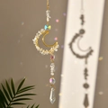 Golden crescent moon suncatcher with purple crystal chips and rainbow light reflections - Synthetic Clear Quartz