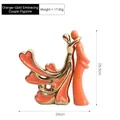 Modern abstract ceramic hugging couple sculpture in orange and gold electroplated finish - Deep Embrace / Metallic Orange