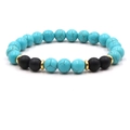 Detail of turquoise beaded bracelet with matte black beads and gold metallic spacers - Blue Turquoise