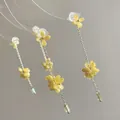 Close-up of yellow resin flower earrings with green pendants and long metal tassels - 1# Silver Earring Post - Yellow - Flower Cluster