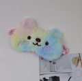 Macro detail of the plush rainbow unicorn sleep mask with soft embroidery and elastic strap - Rainbow Bear