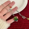 Handmade beaded Christmas tree necklace with green crystal pendants and red bow detail - Titanium Steel Wave Chain-Agate Bead / Necklace