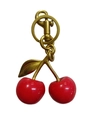 Red cherry keychain with gold alloy hardware and glossy resin fruit on white background - Dark Red Cherry with Bronze Gold
