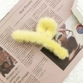 Chic yellow plush hair claw clip for women on newspaper background for autumn and winter - Bright Yellow