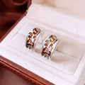 Detail of silver C-shape earrings with orange enamel leopard pattern and vintage texture - Silver (Silver Pin)