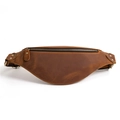 Detailed shot of brown leather waist bag featuring metal zippers and sturdy D-ring hooks - Yellow Brown