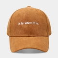 Détail d'une casquette en velours côtelé marron avec broderie blanche 'it is what it is' - Réglable / Camel