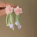Close-up of handmade flower tassel earrings with pink resin petals and green beads - 23# Pink & Green Contrast Beaded Flower Cluster (925 Sterling Silver Earring Post)