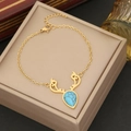 Gold stainless steel antler necklace featuring a pear-cut turquoise gemstone pendant - Bracelet