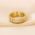 Elegant gold crown ring with sparkling rhinestones on soft beige fabric background - Gold Crown Rhinestone Style (KR50150-GC)