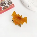 Amber bat-shaped hair claw with gold glitter and silver metal teeth for Halloween styling - 5.2cm / Gold
