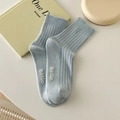 Light blue rib-knit crew socks with white hello embroidery in a soft cotton blend - Milky Blue