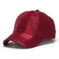 Close-up of distressed ripped details on a vintage burgundy washed denim baseball cap - Burgundy