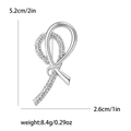 Broche nœud argentée avec strass, taille 5,2cm x 2,6cm et un poids de 8,4g - Argenté